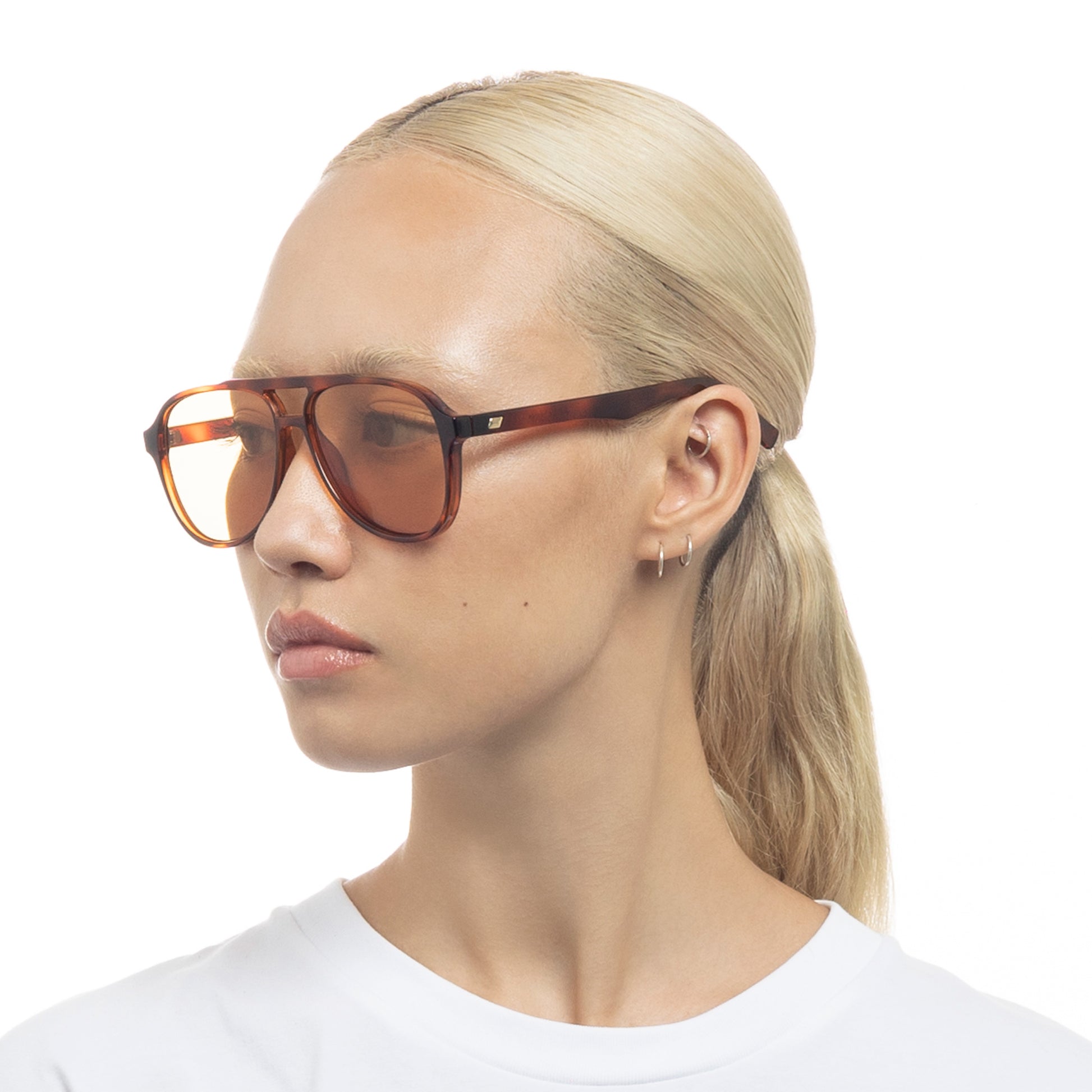Tortoise shell Le Specs sunglasses on a female model side view