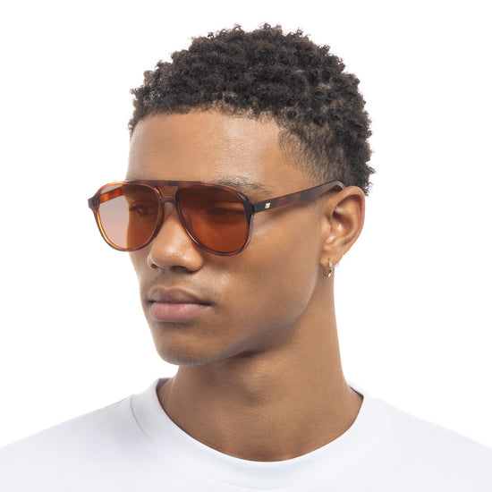 Tortoise shell Le Specs sunglasses on male model side view