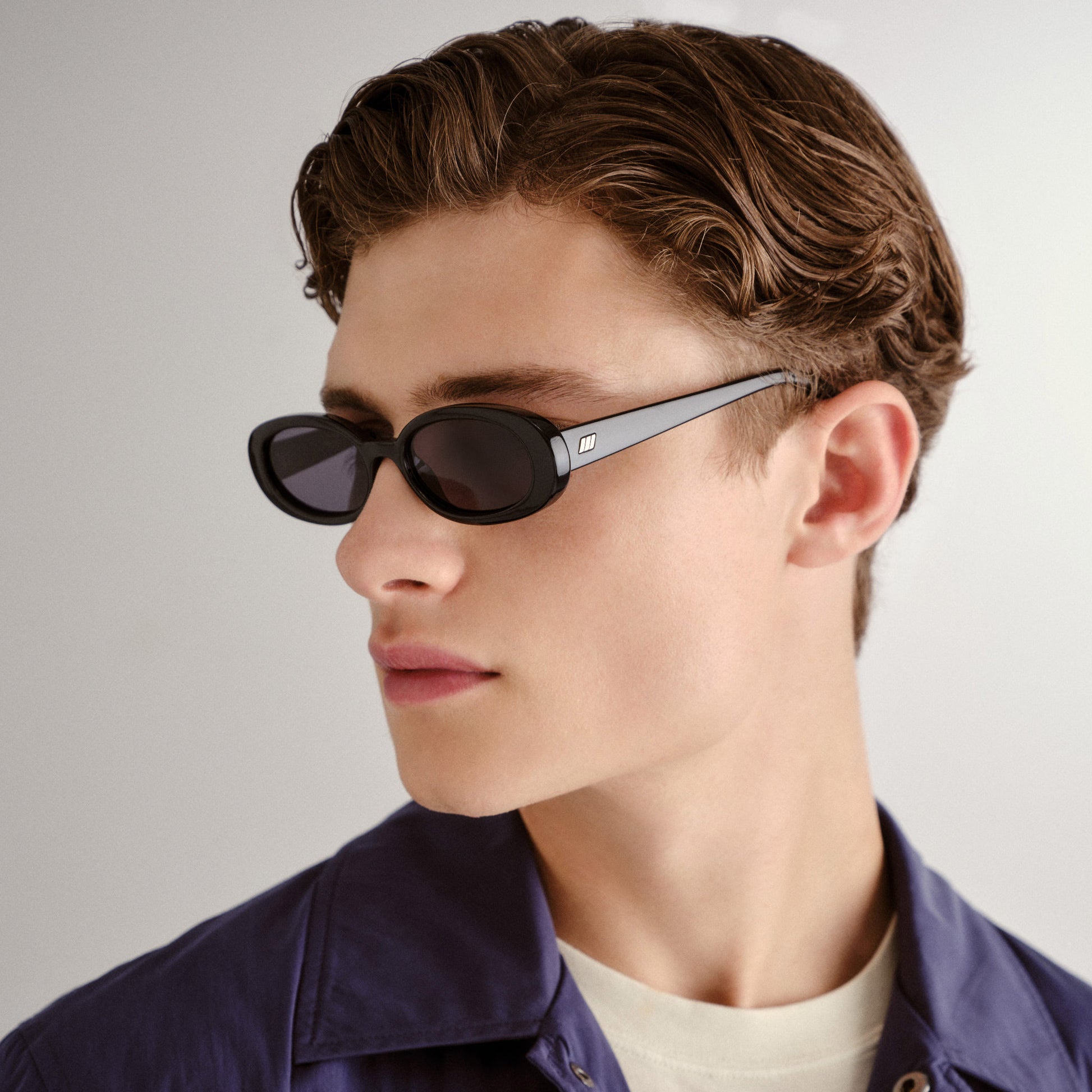 Black Le Specs Sunglasses on a male model side view