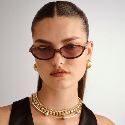 brown Le Specs sunglasses on a female model, front view