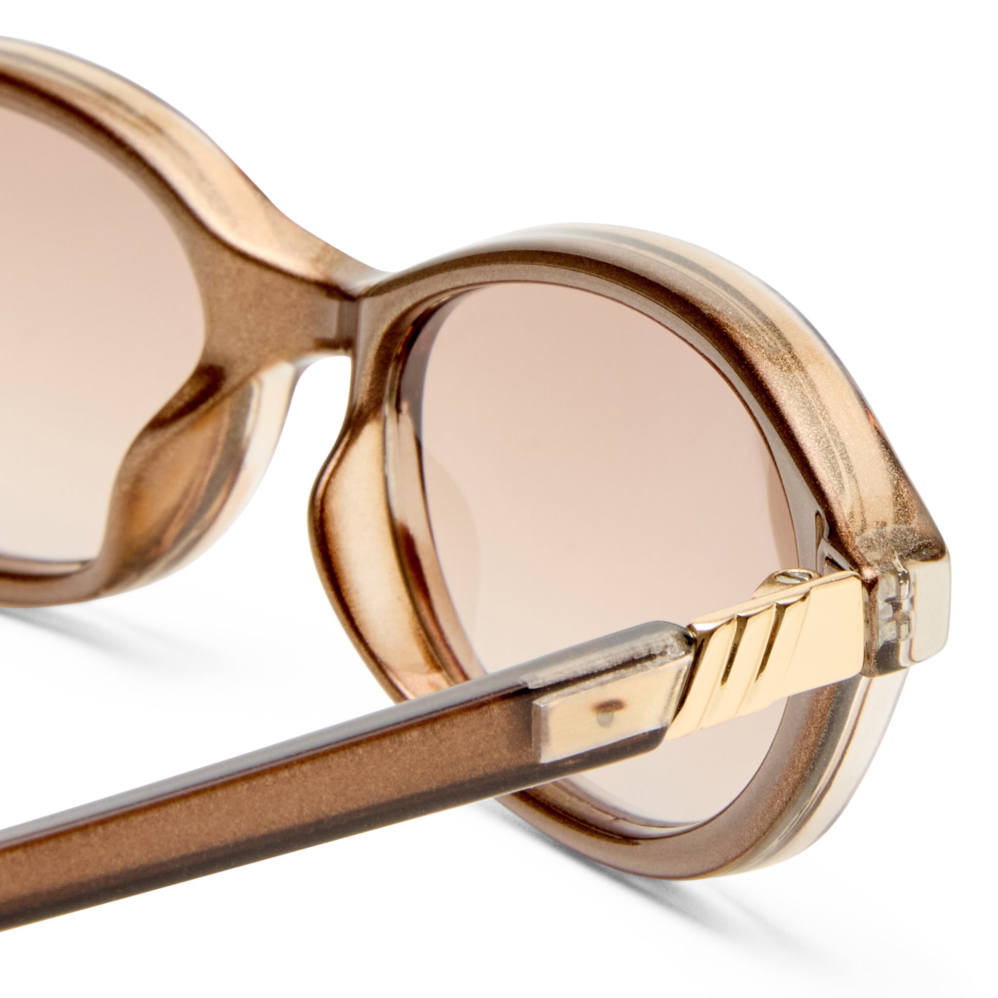 brown Le Specs sunglasses on a white background close up