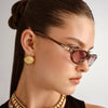 brown Le Specs sunglasses on a female model side view 