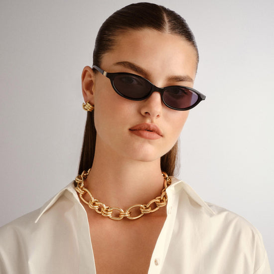 black Le Specs sunglasses on a female model