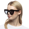 black Le Specs sunglasses on a different model side view