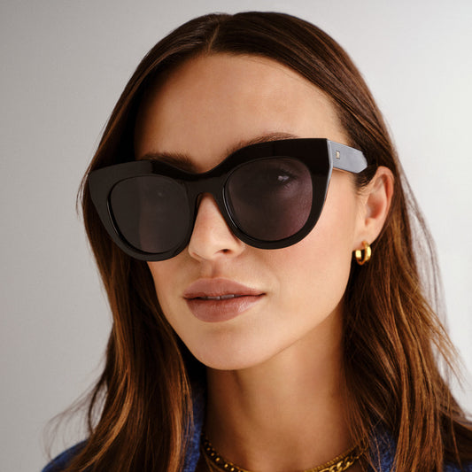 black Le Specs sunglasses on a female model front view