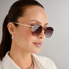 Tortoise shell and gold Le Specs sunglasses on a female model side view