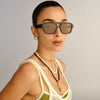 Black Le Specs sunglasses on a female model