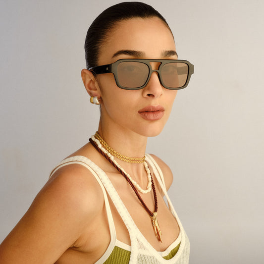 Black Le Specs sunglasses on a female model