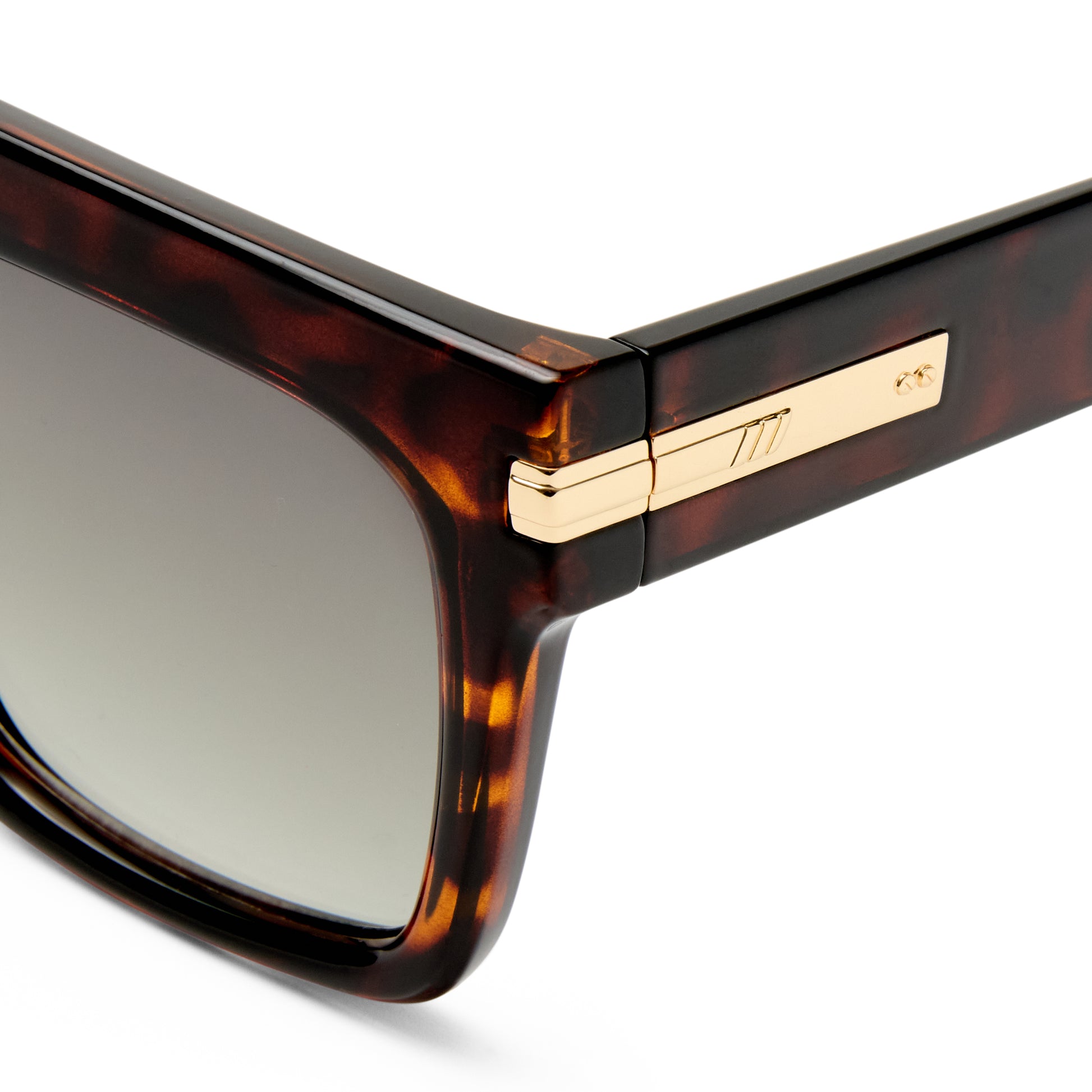 Tortoise shell Le Specs sunglasses on a white background close up