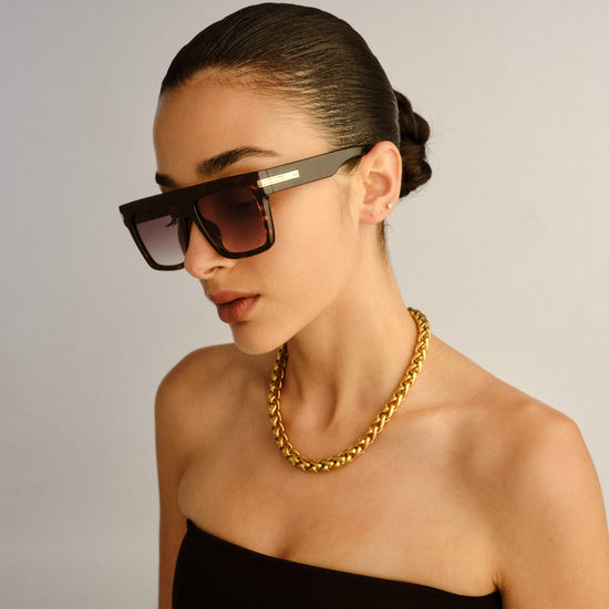 Tortoise shell Le Specs sunglasses on a female model side view