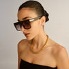 Tortoise shell Le Specs sunglasses on a female model side view