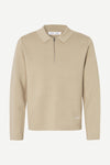 beige quater zip long sleeve polo knit on white background