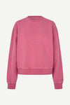 A dusty rose pink crewneck sweatshirt with a relaxed fit, displayed on a clean, light off-white background.