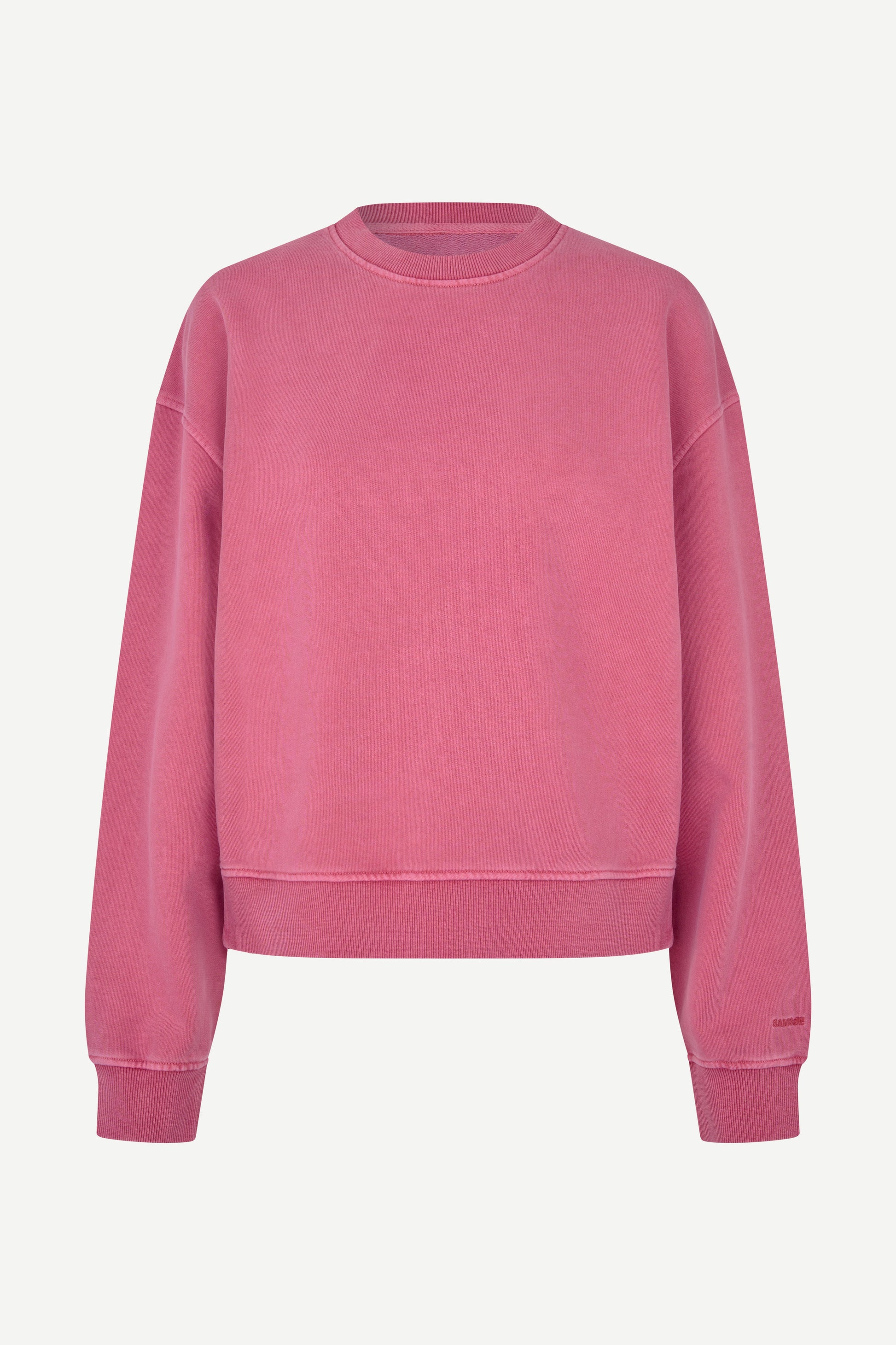 A dusty rose pink crewneck sweatshirt with a relaxed fit, displayed on a clean, light off-white background.