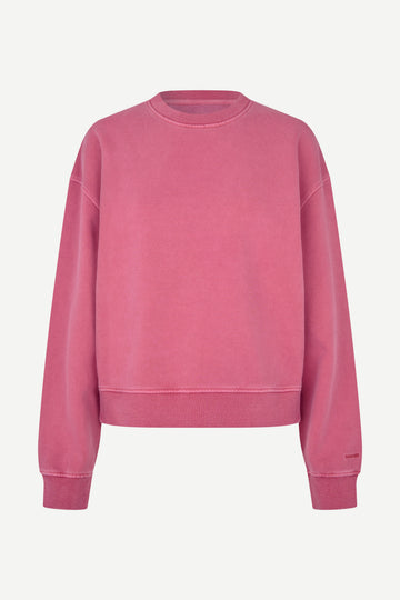 A dusty rose pink crewneck sweatshirt with a relaxed fit, displayed on a clean, light off-white background.