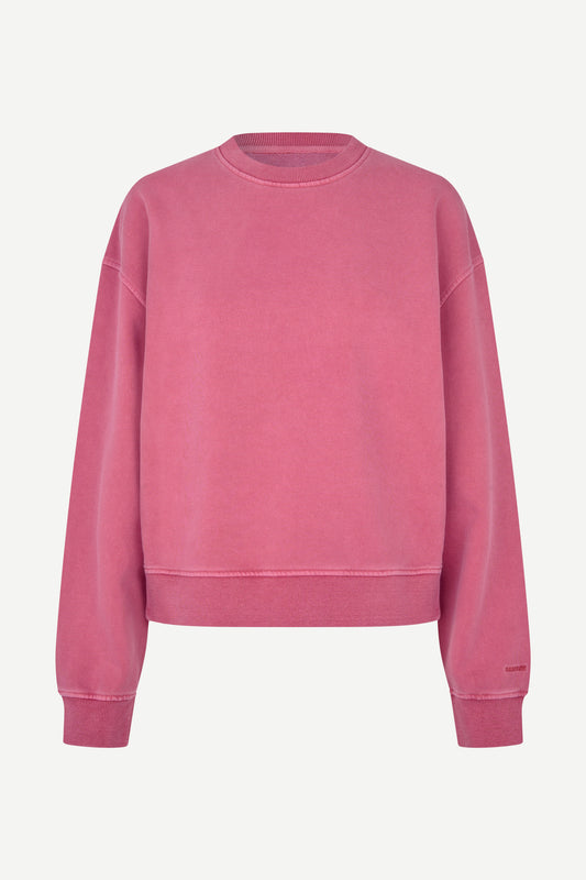 A dusty rose pink crewneck sweatshirt with a relaxed fit, displayed on a clean, light off-white background.