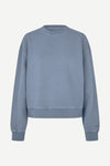 A dusty blue crewneck sweatshirt with a relaxed fit, shown flat against a light off-white background.