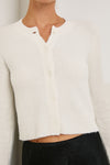 Close up of cropped cream cardigan