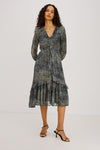 Blue ditsy print dress with long sleeves and v neck worn with a kitten heel