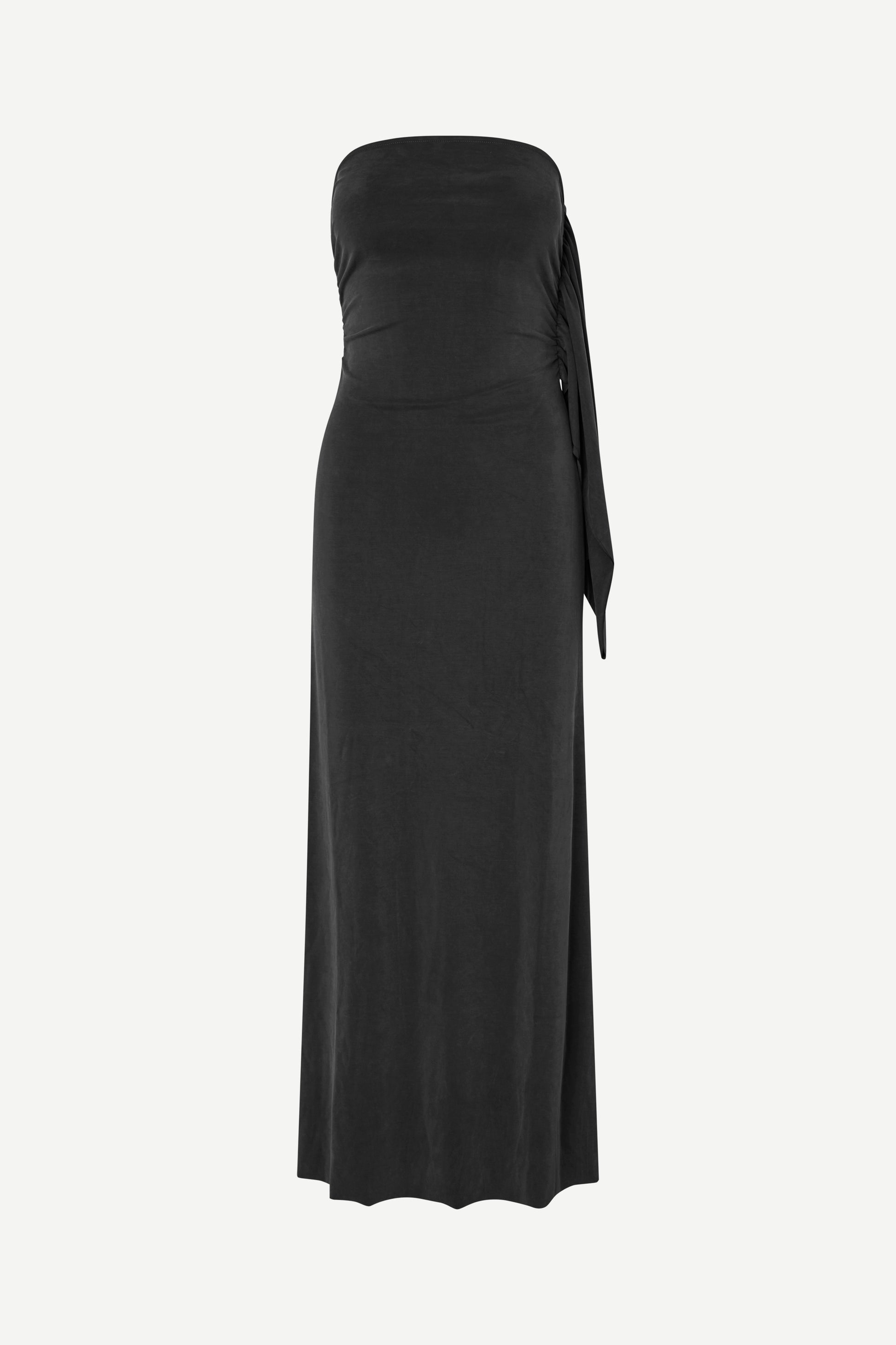 A black strapless maxi dress with a ruched waist and a side tie detail, shown against a plain light gray background.