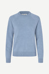 Blue sweater on a white background