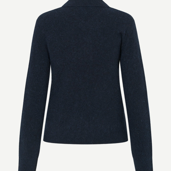 A dark navy blue knit cardigan sweater shown from the back, featuring long sleeves and a simple collar, displayed on a clean, light gray background.