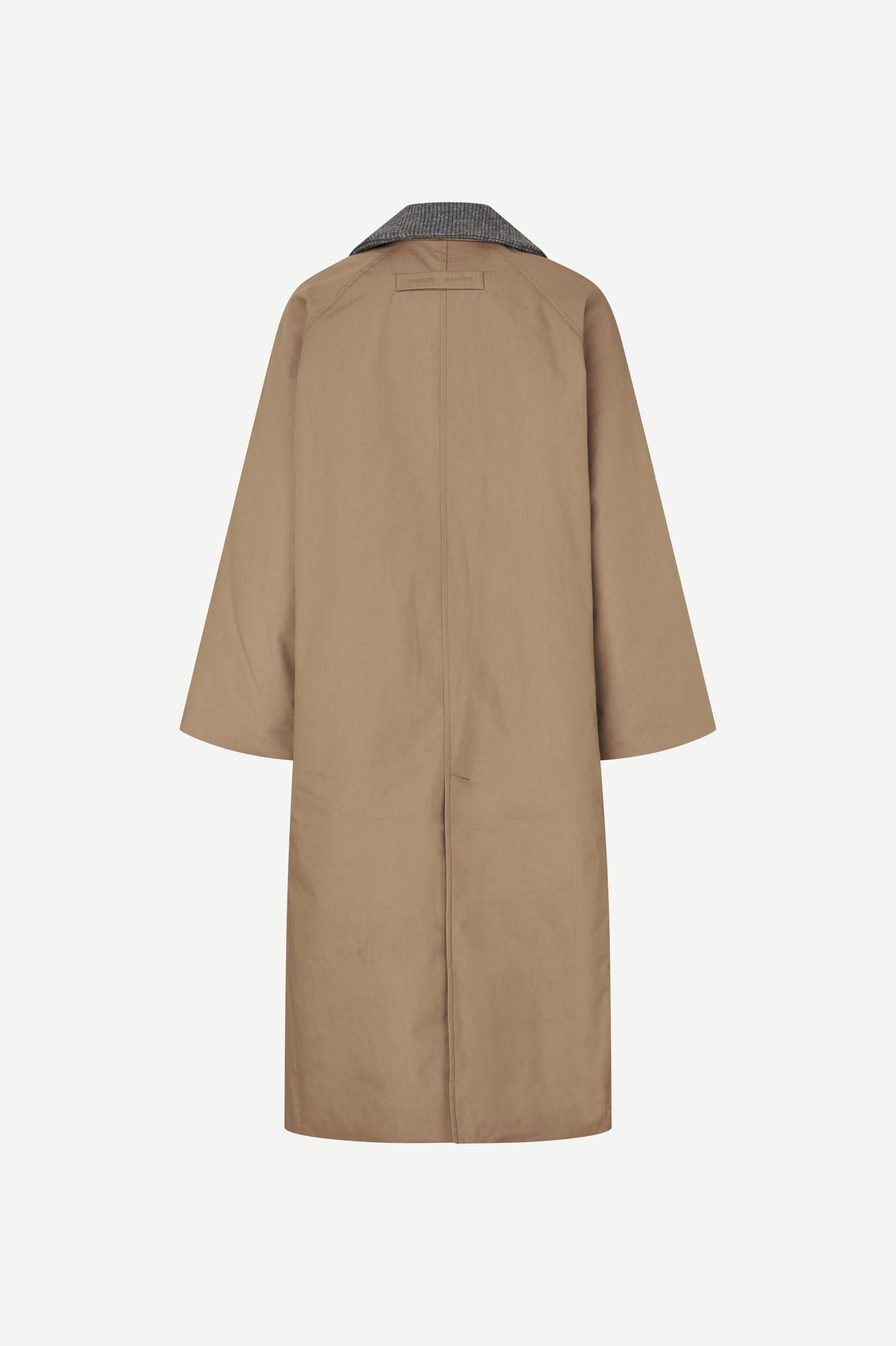 Beige trench coat on a white background