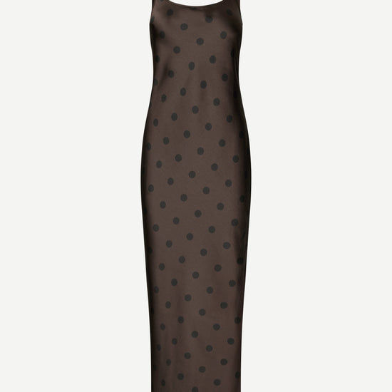 A dark brown sleeveless slip dress with a black polka dot pattern, shown against a plain light gray background.