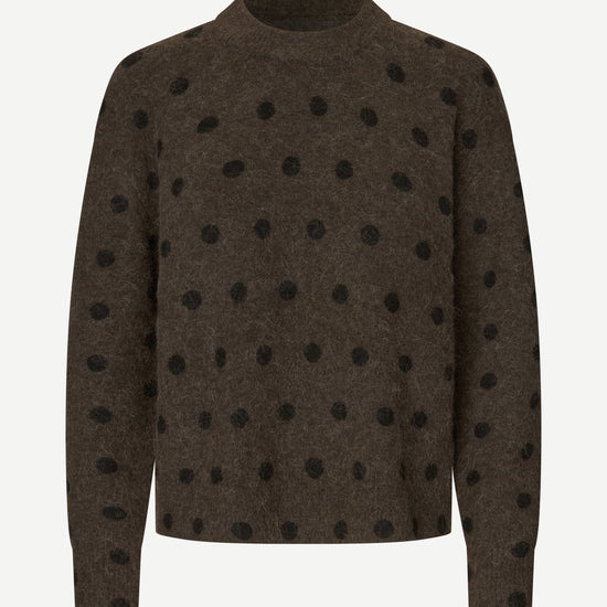 A dark brown knit sweater with black polka dots, displayed on a clean white background.