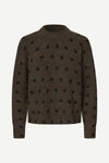 A dark brown knit sweater with black polka dots, displayed on a clean white background.