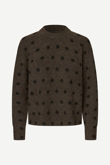A dark brown knit sweater with black polka dots, displayed on a clean white background.