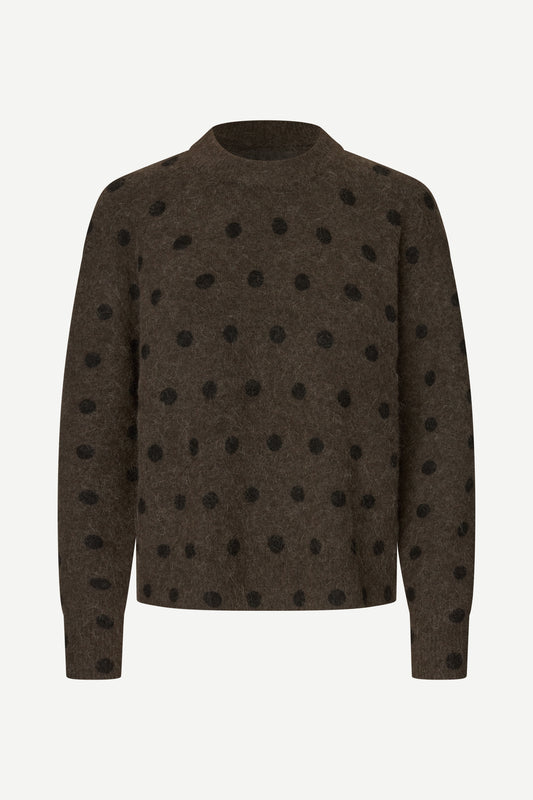 A dark brown knit sweater with black polka dots, displayed on a clean white background.