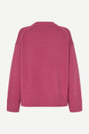 A pink knit sweater shown from the back, featuring a crew neck, raglan sleeves, and ribbed cuffs and hem, displayed on a clean white background.