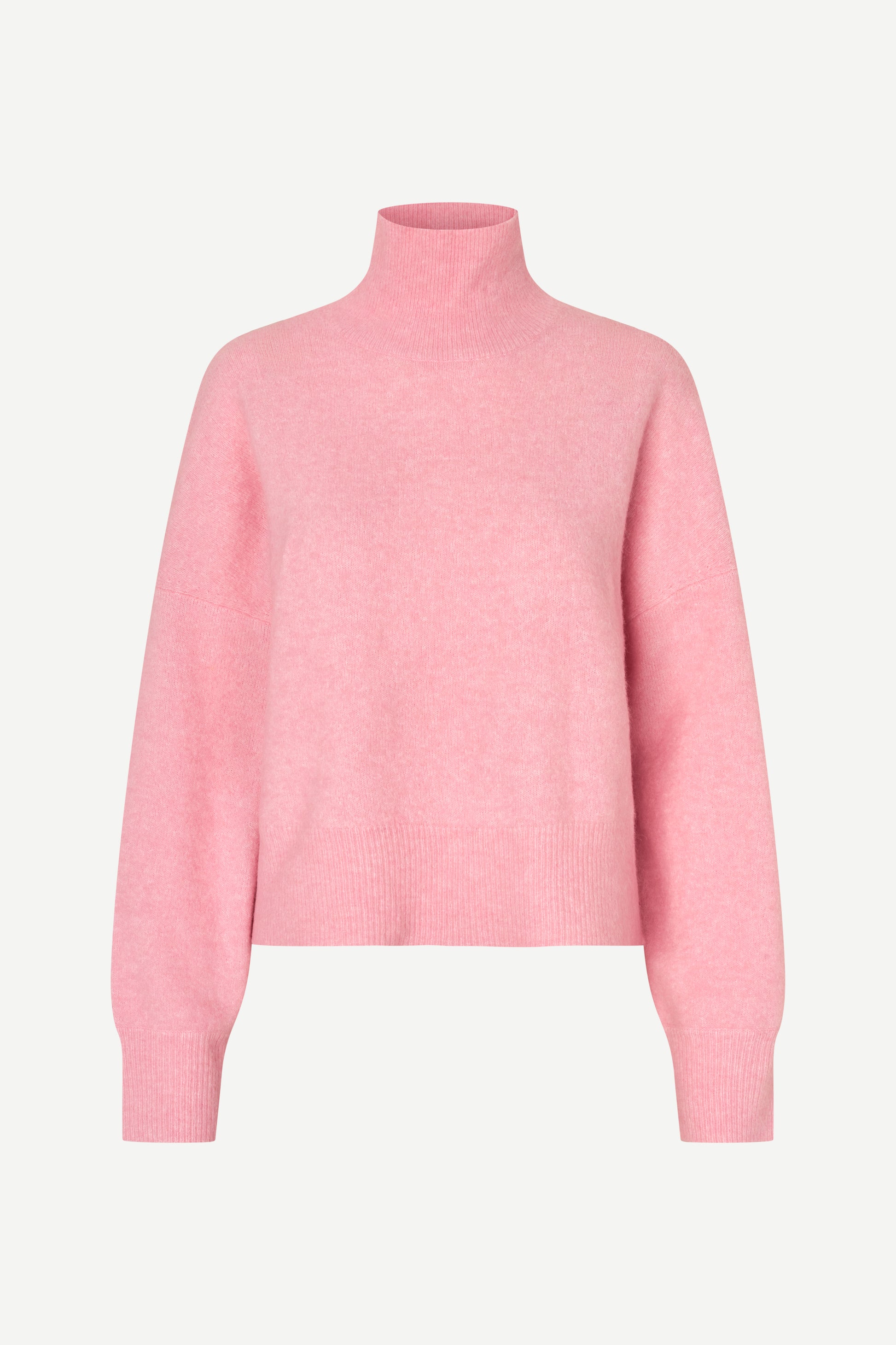 A light pink knit turtleneck sweater displayed on a clean, light gray background.