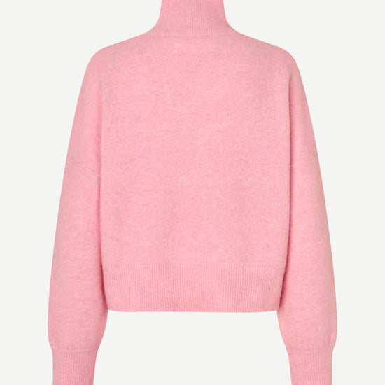 A light pink knit sweater with a mock neck and long sleeves, shown from the back on a clean, light off-white background.