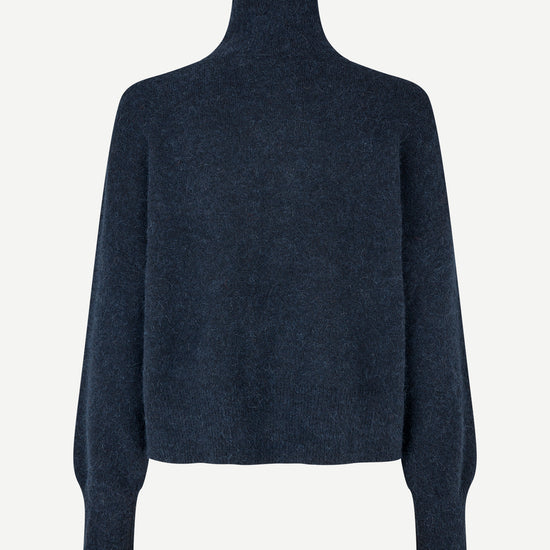 A dark navy blue knit turtleneck sweater with long sleeves, shown from the back on a light gray background.