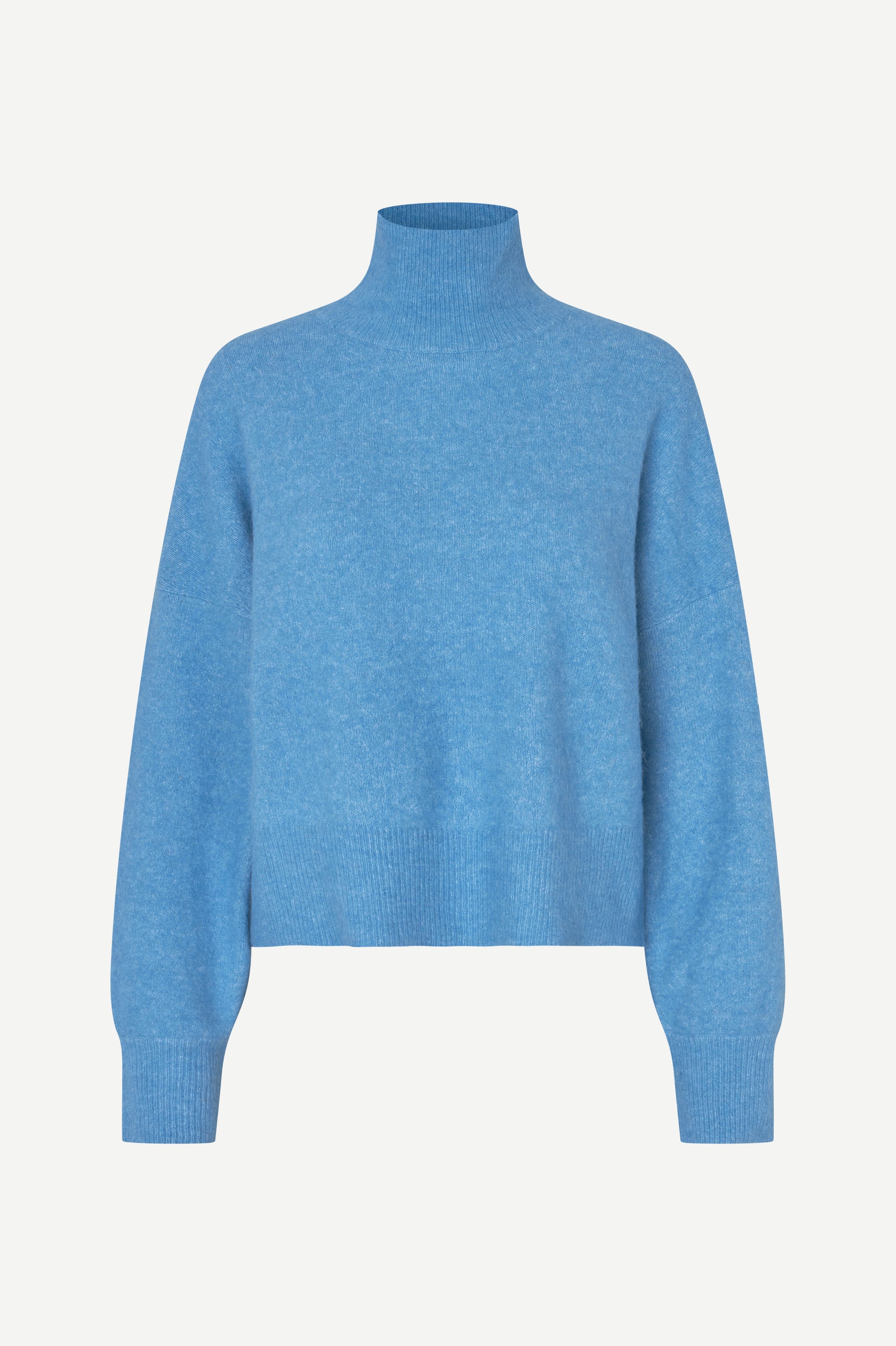 A light blue knit turtleneck sweater with long sleeves and ribbed cuffs, displayed on a clean, light off-white background.