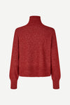 A heathered burgundy knit turtleneck sweater with long sleeves, shown from the back against a light gray background.