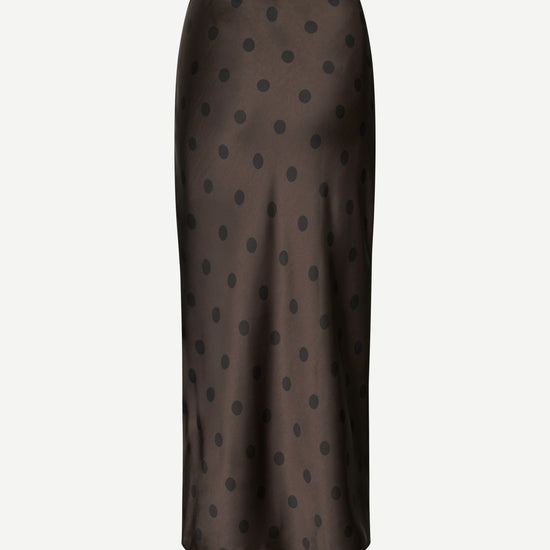 Dark brown skirt with black polka dots on a white background