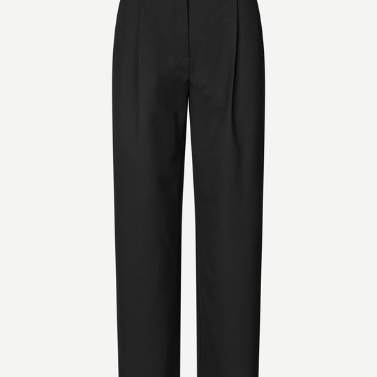 Black wide-leg cropped trousers with front pleats, shown on a light gray background.