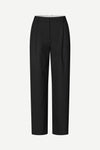 Black wide-leg cropped trousers with front pleats, shown on a light gray background.