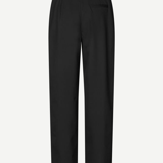 Black wide-leg cropped trousers with a flat front and belt loops, shown against a plain light gray background.