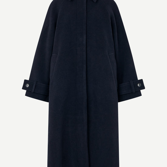 A dark navy blue wool-blend coat with a collar, front button closure, and buttoned cuffs, shown on a light gray background.