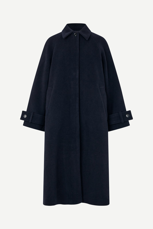 A dark navy blue wool-blend coat with a collar, front button closure, and buttoned cuffs, shown on a light gray background.
