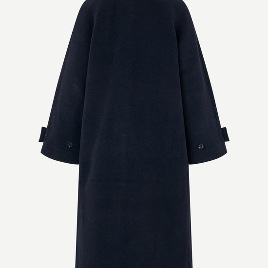 A dark navy blue coat shown from the back, featuring a collar and sleeve cuffs with button details, set against a plain light gray background.