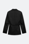 A black long-sleeve blazer jacket with a self-tie belt at the waist, shown from the back against a light gray background.