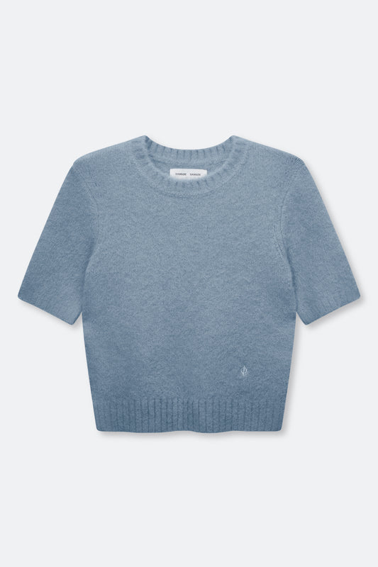 A light blue short-sleeve knit sweater with a crew neck and ribbed hem, displayed flat against a light gray background.
