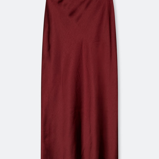 A dark burgundy midi skirt with a subtle satin sheen, shown flat against a light gray background.