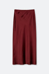 A dark burgundy midi skirt with a subtle satin sheen, shown flat against a light gray background.