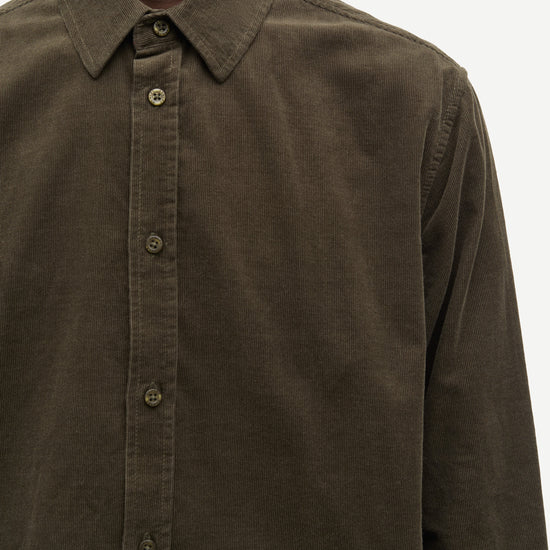 Close up of man wearing green cord shirt